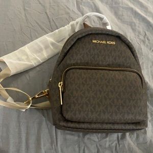 Brand new Michael Kors  mini back pack purse